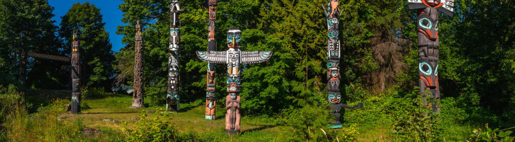Totem poles representing native culture in stanley park, vancouver